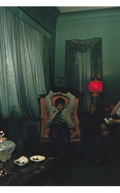 William Eggleston, Sumner, Mississippi (young man in chair), 1972