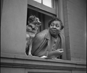 Gordon Parks, Woman and Dog in Window, Harlem, New York, 1943